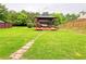 Backyard gazebo with comfortable seating creates a tranquil outdoor retreat at 634 Friars Head Dr, Suwanee, GA 30024