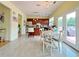 Spacious kitchen with adjacent dining area, stainless appliances and access to outdoor living at 634 Friars Head Dr, Suwanee, GA 30024
