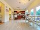 Cozy dining area adjacent to the kitchen, featuring a chandelier and a view of the backyard at 634 Friars Head Dr, Suwanee, GA 30024