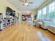 Open concept living room featuring hardwood floors and seamless connection to the dining and kitchen areas at 634 Friars Head Dr, Suwanee, GA 30024