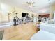 Bright living room features hardwood floors and transitions into dining and kitchen at 634 Friars Head Dr, Suwanee, GA 30024