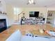 Spacious living room with a fireplace and plenty of natural light at 634 Friars Head Dr, Suwanee, GA 30024