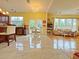 Bright open floor plan with tile floors, connecting the kitchen, dining area, and living room at 634 Friars Head Dr, Suwanee, GA 30024