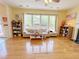 Cozy living room with lots of natural light and hardwood floors at 634 Friars Head Dr, Suwanee, GA 30024