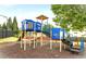 Community playground with slide, climbing structures and shaded seating area at 634 Friars Head Dr, Suwanee, GA 30024