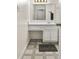 Modest bathroom featuring a vanity with a makeup area, mirror and tile flooring at 906 Country Park Se Dr, Smyrna, GA 30080