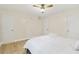 Inviting bedroom with a queen bed, ceiling fan, and two entry doors at 906 Country Park Se Dr, Smyrna, GA 30080