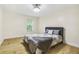 Bright bedroom featuring a queen bed, light walls, and a window overlooking the outdoor scenery at 906 Country Park Se Dr, Smyrna, GA 30080