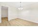 Dining room featuring neutral walls, wood-look floors, and modern lighting at 906 Country Park Se Dr, Smyrna, GA 30080