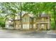 Inviting condo community with mature trees, walkways, and outdoor living spaces at 906 Country Park Se Dr, Smyrna, GA 30080