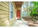Inviting front door and exterior with a tan siding and a well maintained walkway at 906 Country Park Se Dr, Smyrna, GA 30080