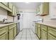 Kitchen featuring ample cabinet space and white appliances at 906 Country Park Se Dr, Smyrna, GA 30080