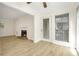 Spacious living room featuring wood-look floors, a fireplace, and lots of natural light at 906 Country Park Se Dr, Smyrna, GA 30080
