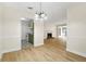 Open concept living space with wood-look floors, a fireplace, and views of the kitchen at 906 Country Park Se Dr, Smyrna, GA 30080