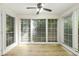 Bright sunroom featuring neutral paint, wood-look floors, and tons of windows at 906 Country Park Se Dr, Smyrna, GA 30080