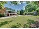 This sprawling backyard includes a storage shed, garden, and plenty of lawn for outdoor enjoyment at 243 Woodview Ln, Smyrna, GA 30082