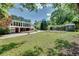 Sprawling backyard with mature trees, a charming shed, and plenty of green space for outdoor activities at 243 Woodview Ln, Smyrna, GA 30082
