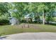 Image showcasing the property's spacious backyard and shed surrounded by lush trees at 243 Woodview Ln, Smyrna, GA 30082