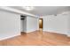 Finished basement features hardwood floors, white walls, and a closet at 243 Woodview Ln, Smyrna, GA 30082