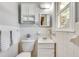 Cozy bathroom features a sink with storage, toilet, and built-in shelving for linens at 243 Woodview Ln, Smyrna, GA 30082
