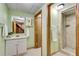 Bathroom featuring a vanity with sink and walk-in tiled shower at 243 Woodview Ln, Smyrna, GA 30082