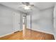 Bedroom featuring hardwood floors, neutral paint, ceiling fan, and good natural light at 243 Woodview Ln, Smyrna, GA 30082