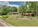 Well-maintained lawn with landscaping leading to the front of the brick house at 243 Woodview Ln, Smyrna, GA 30082