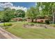Well-manicured lawn and landscaped flower beds enhance the curb appeal of this lovely brick home at 243 Woodview Ln, Smyrna, GA 30082