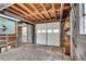 Unfinished garage interior with concrete floor, cinder block walls, and exposed wood joist ceiling at 243 Woodview Ln, Smyrna, GA 30082