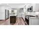 Updated kitchen with white cabinets, stainless steel appliances, granite countertops, and center island at 243 Woodview Ln, Smyrna, GA 30082