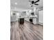 Spacious kitchen features granite countertops, white cabinets, stainless appliances, and wood flooring at 243 Woodview Ln, Smyrna, GA 30082