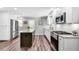 Modern kitchen design with updated cabinets, counters, stainless appliances, and ample lighting at 243 Woodview Ln, Smyrna, GA 30082