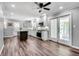 Spacious kitchen view with stainless steel appliances, stone countertops, and patio doors at 243 Woodview Ln, Smyrna, GA 30082