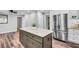 Spacious kitchen with stainless steel appliances, a large island, and wood-look flooring at 243 Woodview Ln, Smyrna, GA 30082