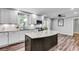 Beautiful kitchen featuring an island, subway tile backsplash, and stainless steel appliances at 243 Woodview Ln, Smyrna, GA 30082