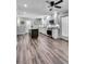 Open-concept kitchen with updated appliances, a center island, and wood-look floors at 243 Woodview Ln, Smyrna, GA 30082