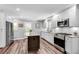 Renovated kitchen with stylish island, stainless steel appliances, and hardwood floors at 243 Woodview Ln, Smyrna, GA 30082