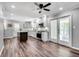 A kitchen with white cabinets, an island with granite countertops and stainless steel appliances at 243 Woodview Ln, Smyrna, GA 30082