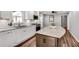 Modern kitchen with white cabinets, granite countertops, stainless steel appliances, and a stylish center island at 243 Woodview Ln, Smyrna, GA 30082