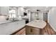 Bright kitchen featuring granite countertops, white cabinets, and stainless steel appliances at 243 Woodview Ln, Smyrna, GA 30082