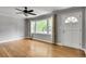 Light filled living room with hardwood floors, neutral walls and large windows at 243 Woodview Ln, Smyrna, GA 30082
