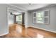 Open floor plan with hardwood floors, light paint, and access to other rooms at 243 Woodview Ln, Smyrna, GA 30082