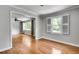 Bright living room featuring beautiful hardwood floors and fresh paint throughout the open floor plan at 243 Woodview Ln, Smyrna, GA 30082