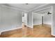 Spacious living room featuring hardwood floors and easy access to other rooms at 243 Woodview Ln, Smyrna, GA 30082