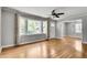 Bright living room with large window, hardwood floors, and neutral paint at 243 Woodview Ln, Smyrna, GA 30082