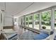 Large sunroom with many windows and comfortable wicker seating at 243 Woodview Ln, Smyrna, GA 30082