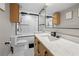 Modern bathroom featuring a shower with glass doors, a stylish vanity, and black hardware at 2479 Peachtree Ne Rd # 1801, Atlanta, GA 30305