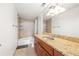 Bright bathroom features a vanity with granite countertop, tile flooring and a shower-tub combination at 2479 Peachtree Ne Rd # 1801, Atlanta, GA 30305