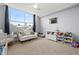 Bedroom featuring city views, a white sofa, and plenty of storage for toys at 2479 Peachtree Ne Rd # 1801, Atlanta, GA 30305