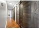 Hallway featuring sliding barn doors and wood floors at 2479 Peachtree Ne Rd # 1801, Atlanta, GA 30305